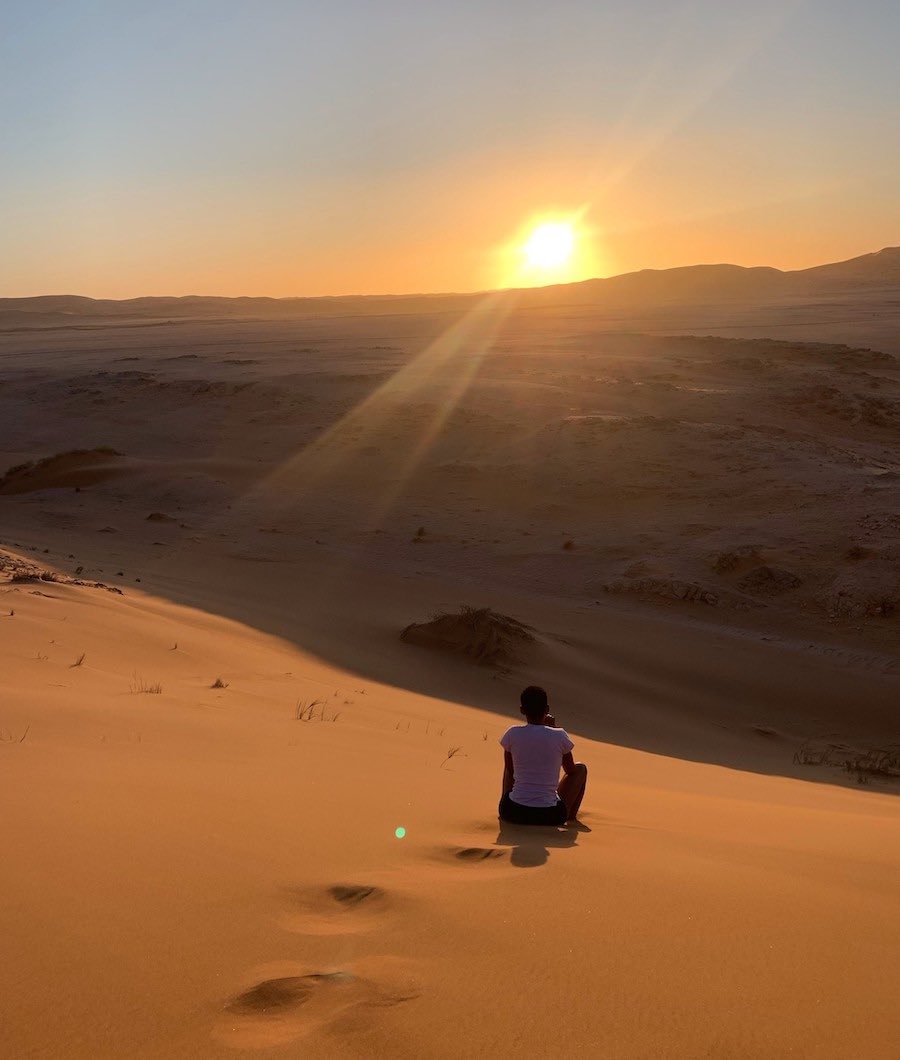 Sun low in the sky over the dunes.